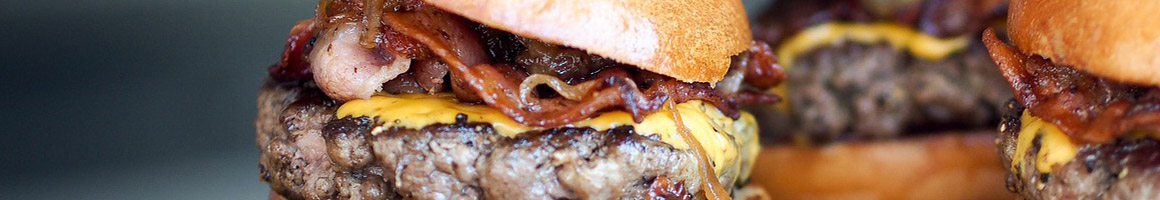 Eating American (Traditional) Burger Sandwich at Riverside Lunch restaurant in Charlottesville, VA.